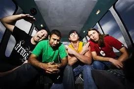 Rebelution band members inside a tour vehicle